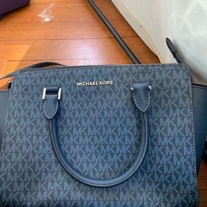 Michael kors bags.  100 each for the clutch is 50